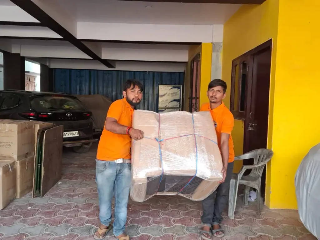 Mehar Packers and Movers team wrapping and loading household items during a home shifting service in Patna.