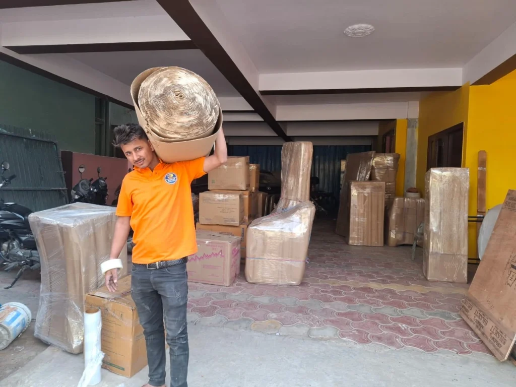 Mehar Packers and Movers staff carrying packing material for household shifting in Patna.
