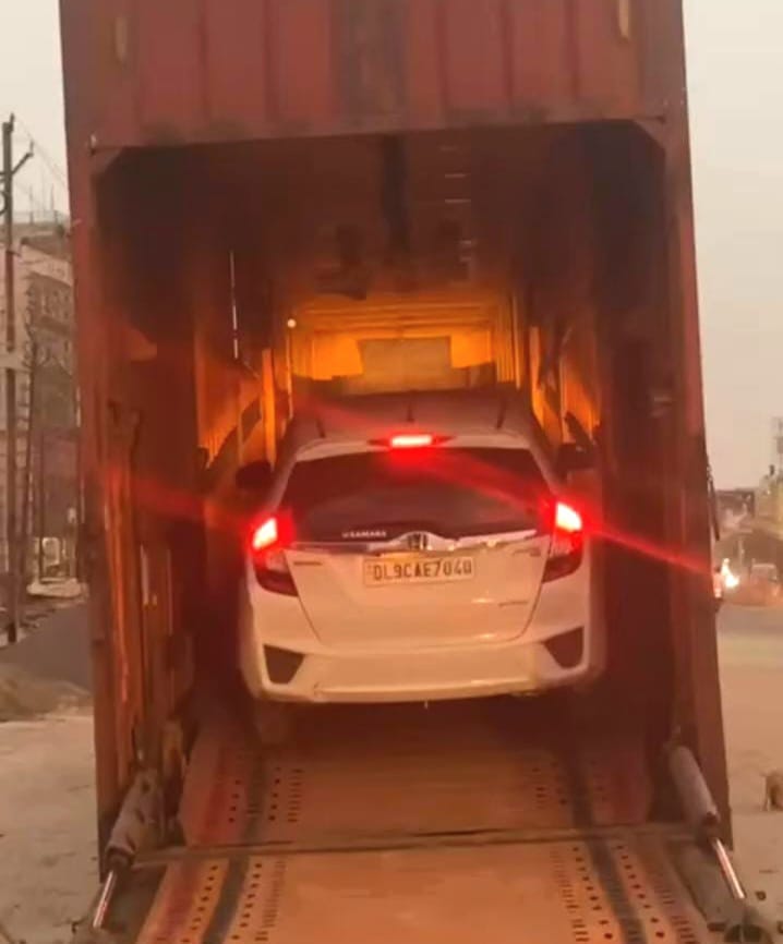 Car being loaded into vehicle carrier by Mehar Packers and Movers for car shifting in Patna.
